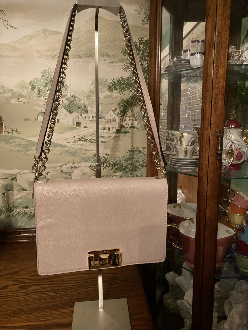 Furla EUC Mimì Mini Crossbody Bag,
in a light pink/beige leather.